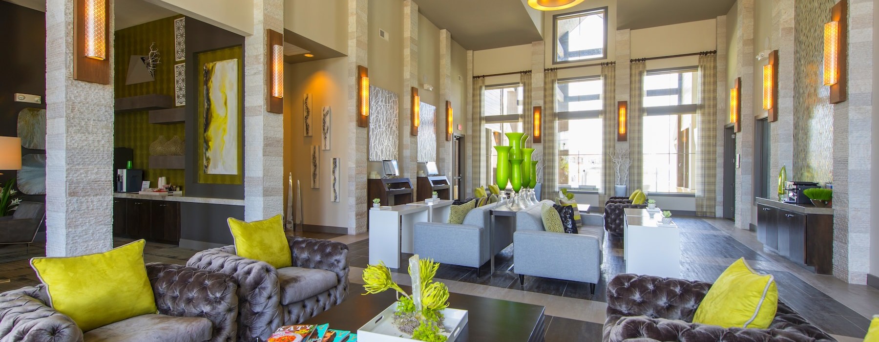 a lounge with seating and tables