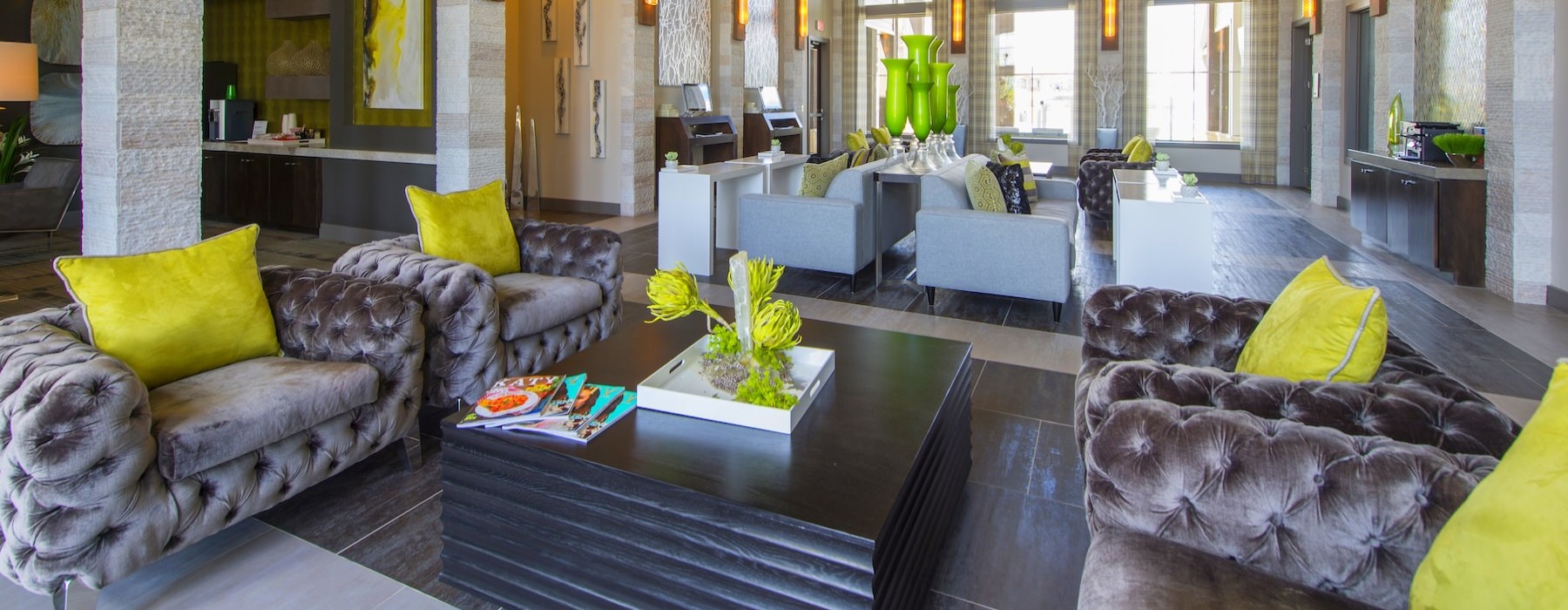 a lounge with seating and tables