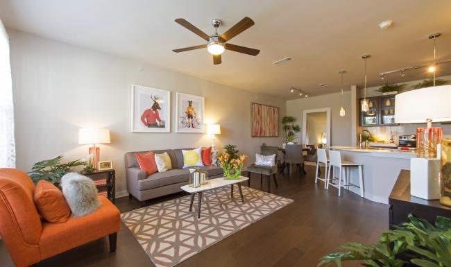 a living room with a fan